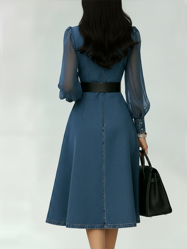 Sophisticated women's denim A-line dress featuring a belt & sheer long sleeves, ideal for work or party.