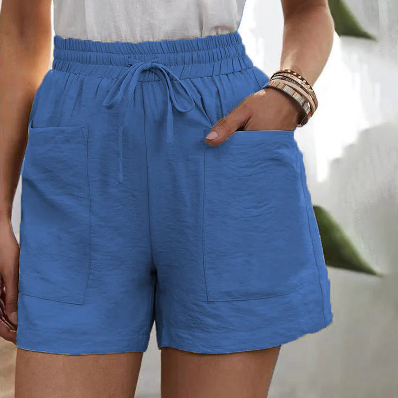 Detail of women's chic summer shorts, highlighting drawstring, side pockets, and comfortable fabric.