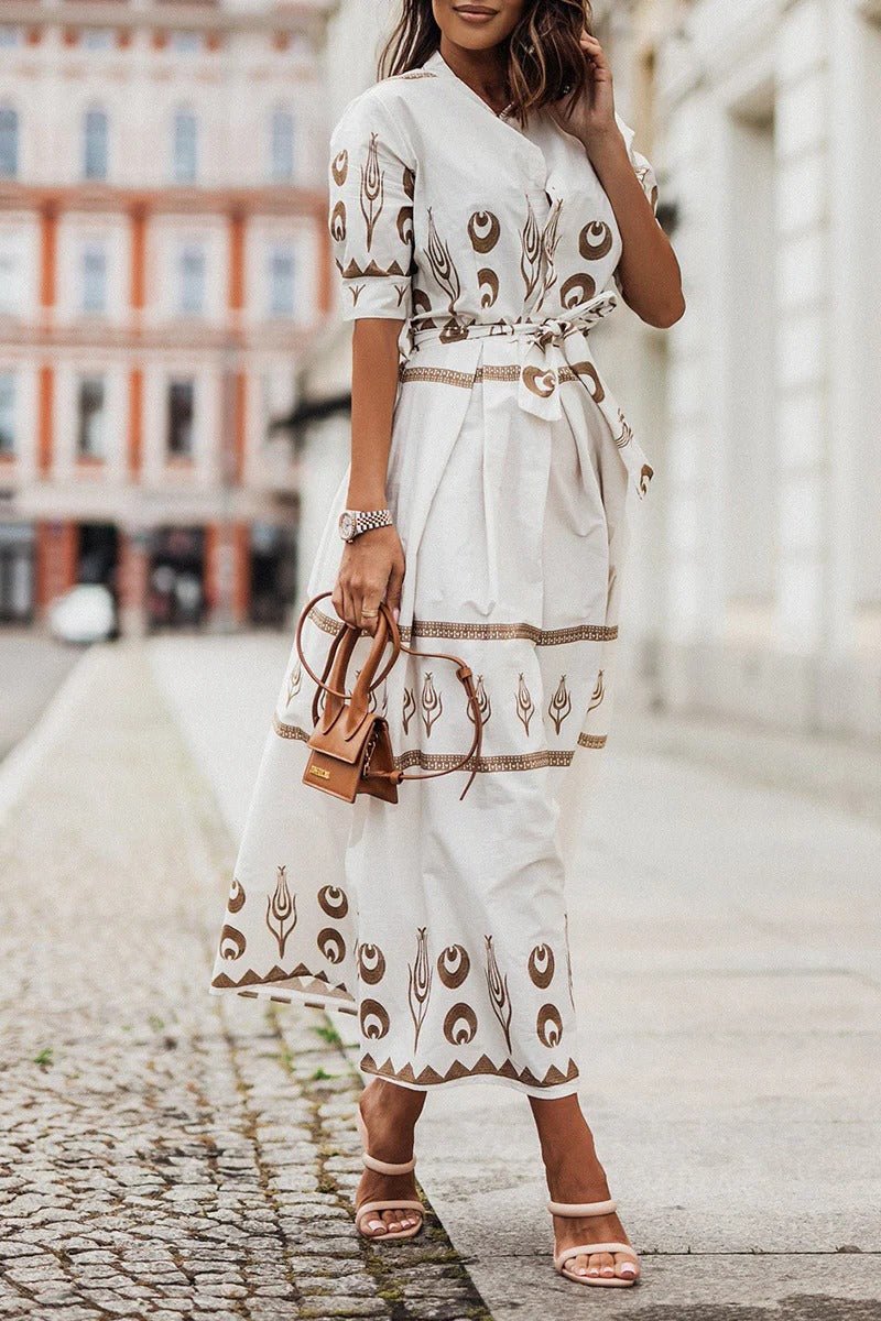 Elegant women's midi cocktail dress. Geometric print, mock neck, three-quarter sleeves & chic belted waist.
