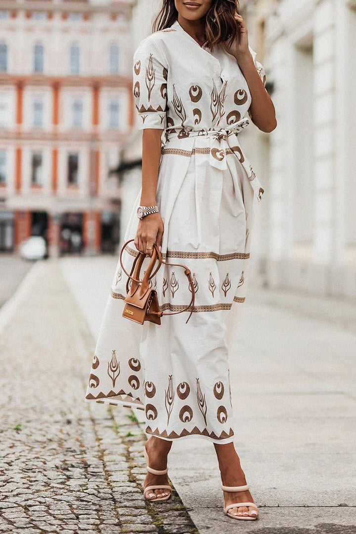 Elegant women's midi cocktail dress. Geometric print, mock neck, three-quarter sleeves & chic belted waist.