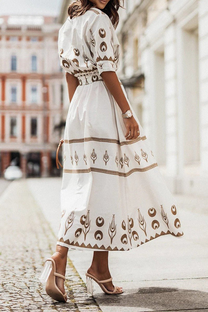 Sophisticated women's party dress. Geometric print midi with a flattering belted waist, perfect for evening wear.