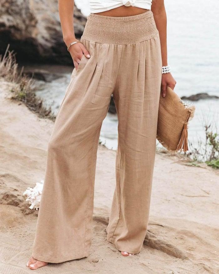 Women's high-rise wide-leg smocked flowing pants, perfect for a relaxed fit and all-day comfort.