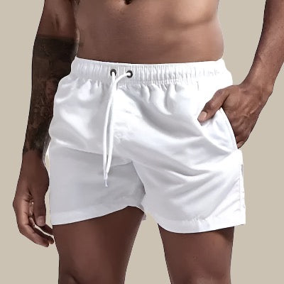 Casual men's swimwear: relaxed fit drawstring shorts perfect for summer beach fashion & swimming.