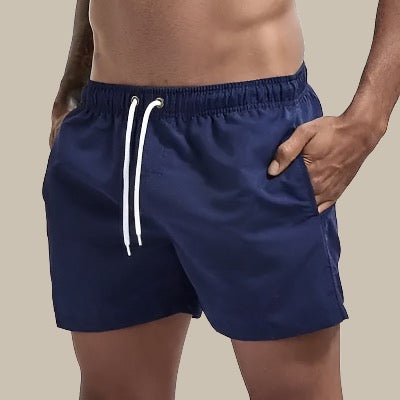 Comfortable men's drawstring swim shorts, relaxed fit, versatile for all summer beach & pool fun.