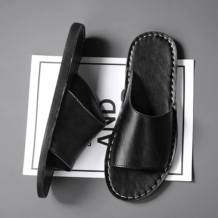 Relaxing men's slide sandals, a timeless single band design for summer comfort.
