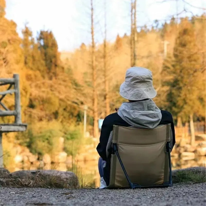 Compact foldable chair for beach, camping, picnic, and outdoor events. Portable & comfortable back support.