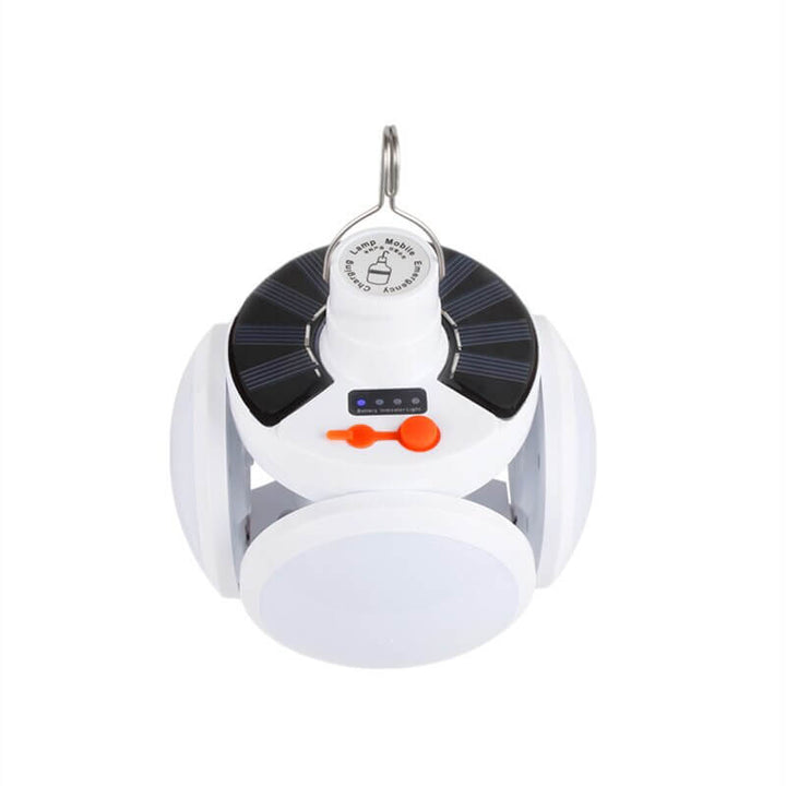 Compact foldable solar LED bulb. Portable camping lantern with USB charging for outdoor & emergency use.