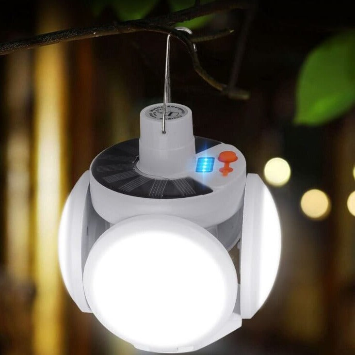 Emergency foldable solar LED bulb. Portable, durable, and bright light for outdoor camping & power outages.