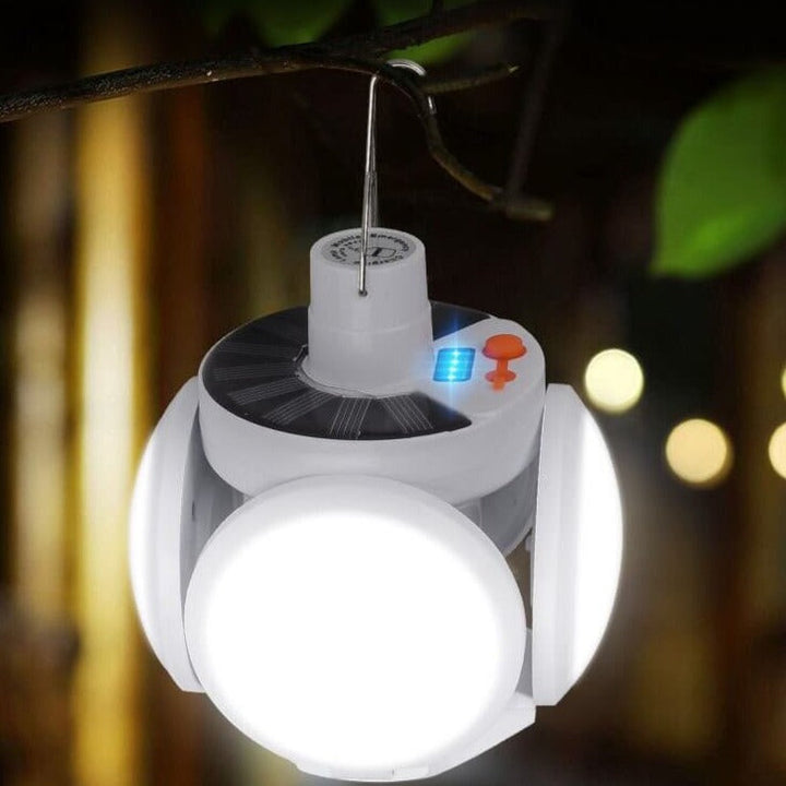 Emergency foldable solar LED bulb. Portable, durable, and bright light for outdoor camping & power outages.
