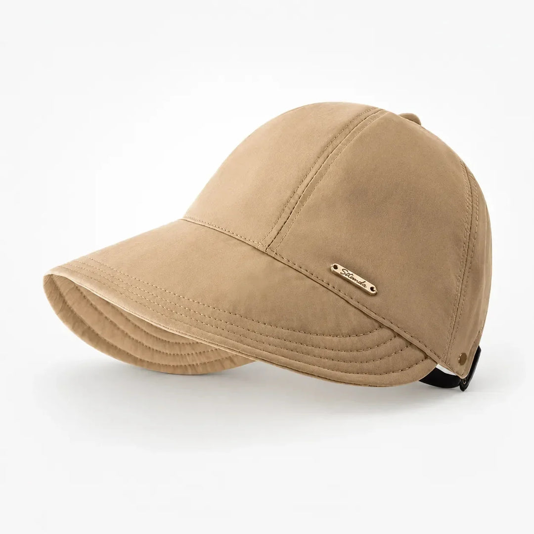 Women's foldable wide-brim sun hat with UPF 50+ protection, perfect for beach & travel.