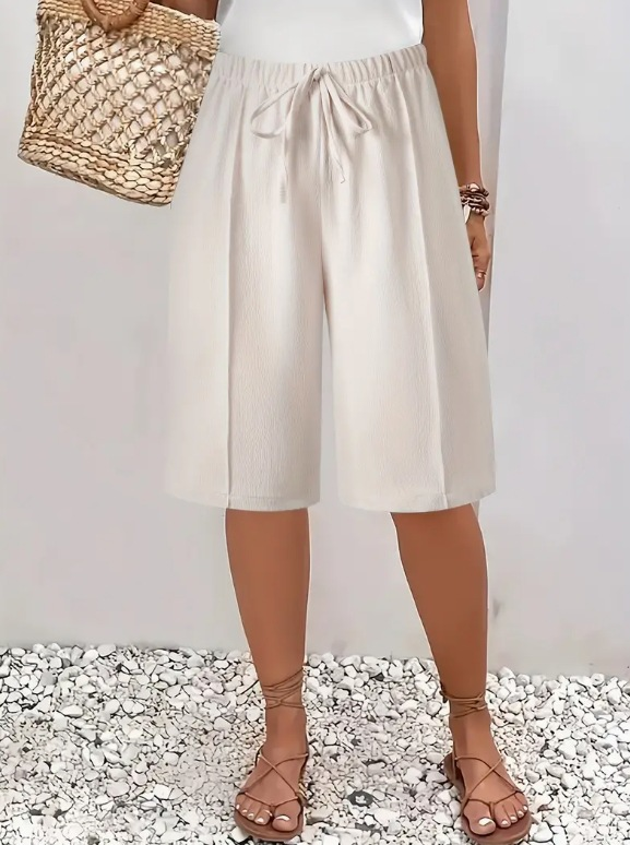 Effortless style: women's knee-length wide leg Bermuda shorts. Comfortable & casual for warm weather apparel.