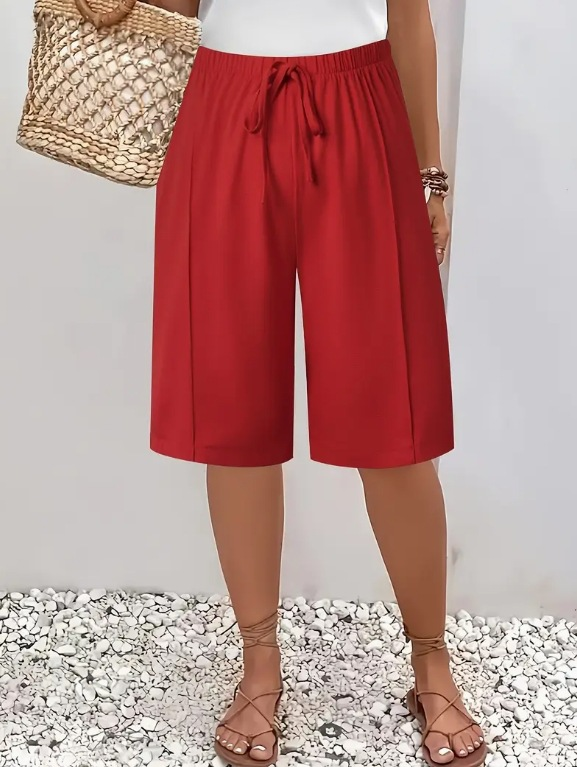 Comfortable women's knee-length shorts, wide leg cut and adjustable drawstring waist for a relaxed fit.