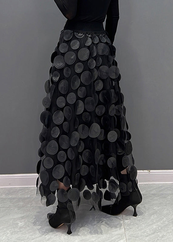 Women's effortless fashion: textured polka dot midi skirt, versatile style.