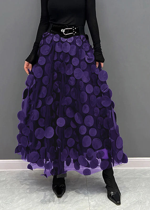 Feminine high-waist A-line midi skirt with subtle texture and polka dots.