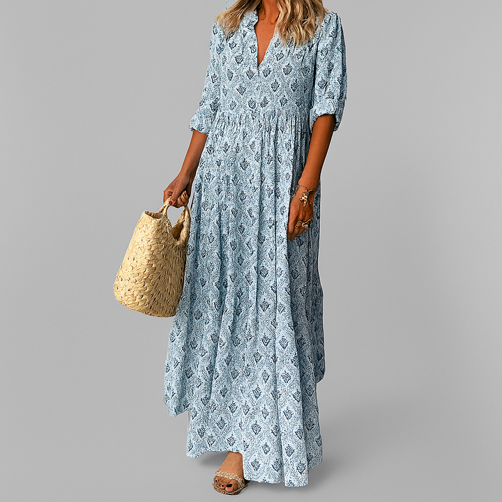 Flowy tiered bohemian print maxi dress for women, ideal for beach vacations & resort wear.