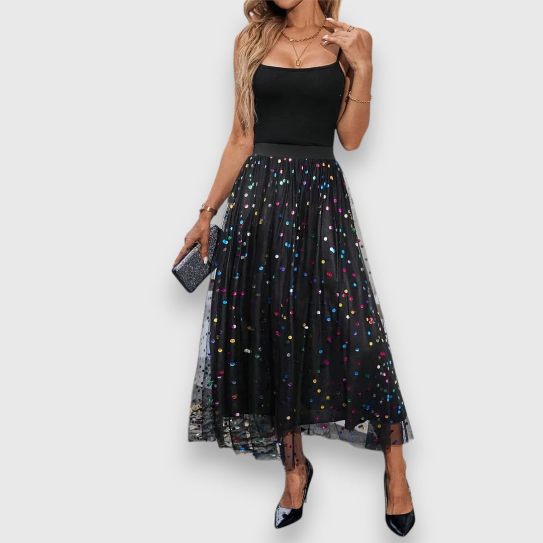 Chic women's polka dot midi skirt, versatile for parties or sophisticated everyday wear.
