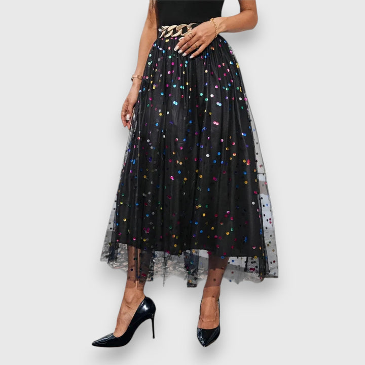 Women's sophisticated polka dot midi skirt, elegant A-line style perfect for evening wear.