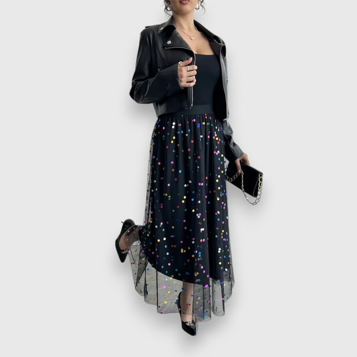 Sophisticated women's polka dot midi skirt. Chic, versatile A-line design, ideal for elegant parties.