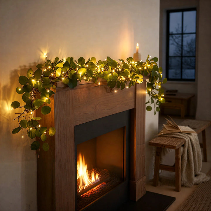 Flexible cordless LED string lights featuring realistic olive branches. Warm white glow for indoor decorative lighting.