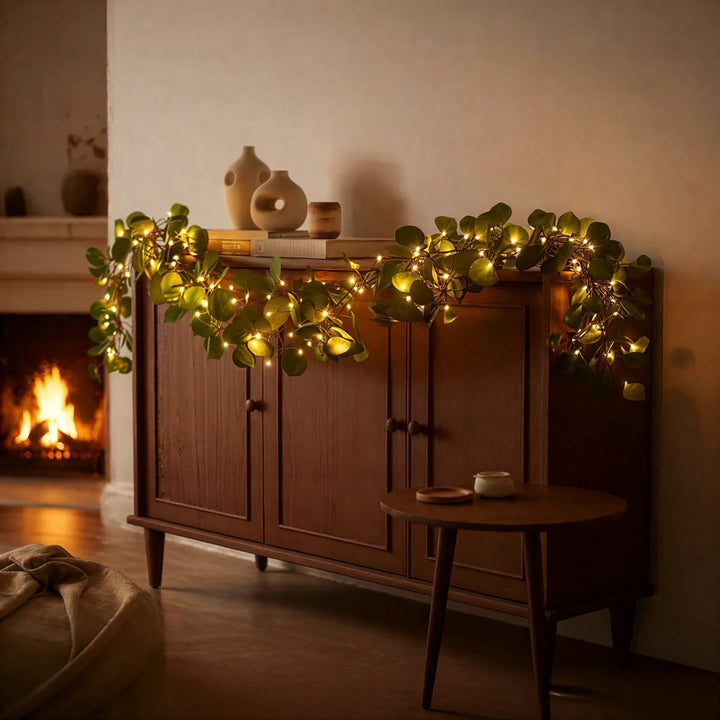Ambiance-enhancing olive branch LED string lights. Cordless, flexible, and battery operated for versatile home decor.