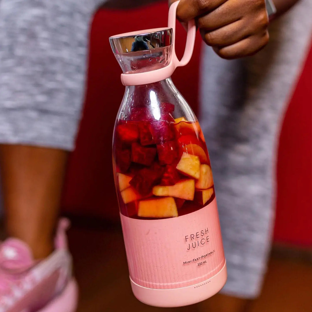Compact personal blender in black, ideal for travel. Make fresh fruit smoothies anywhere, anytime.