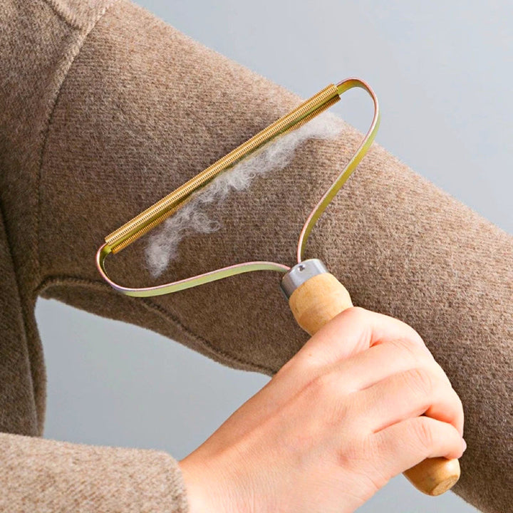 Set of 2 portable lint removers for instant fabric restoration, perfect for pet hair & fuzz on clothes & furniture.