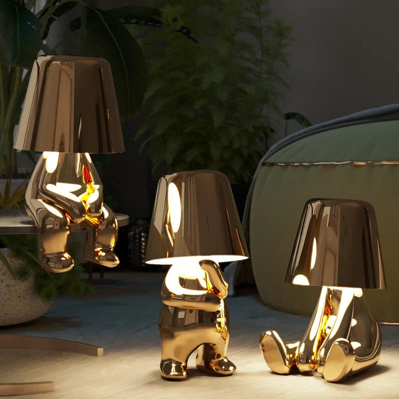 Dimmable LED lamp in artistic figurine design. Touch control and portable for versatile use.