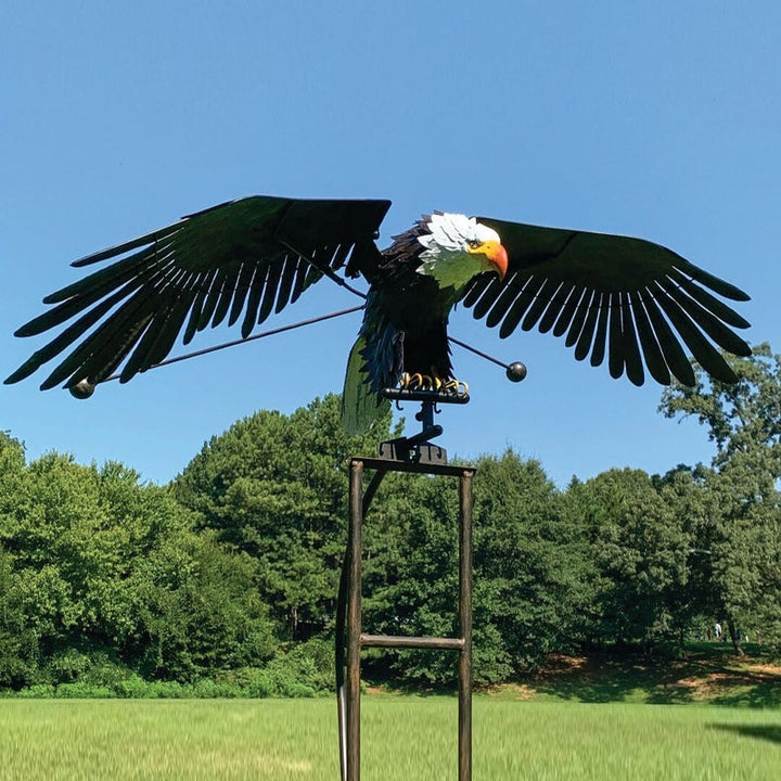 Kinetic bird garden statue, wind-powered metal art for outdoor decor. Perfect weather-resistant patio decoration.