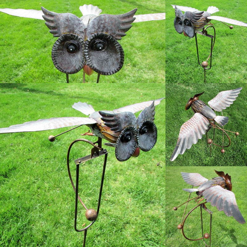 Elegant kinetic bird garden decor, a wind-powered metal art statue for outdoor and patio enhancement.