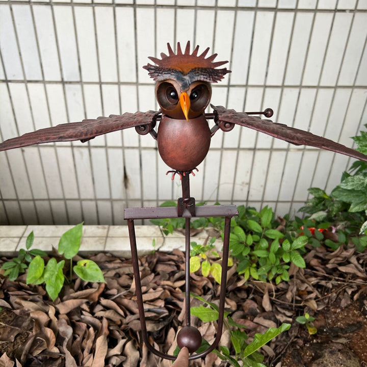 Durable metal kinetic bird statue, a weather-resistant wind-powered garden art piece for any outdoor space.