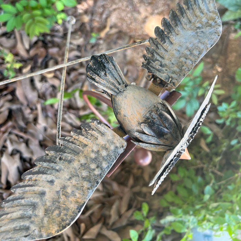 Unique wind-powered kinetic bird statue. Perfect garden art decor, a weather-resistant metal patio gift.