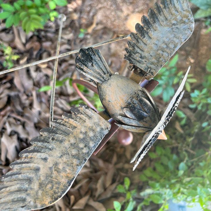 Unique wind-powered kinetic bird statue. Perfect garden art decor, a weather-resistant metal patio gift.