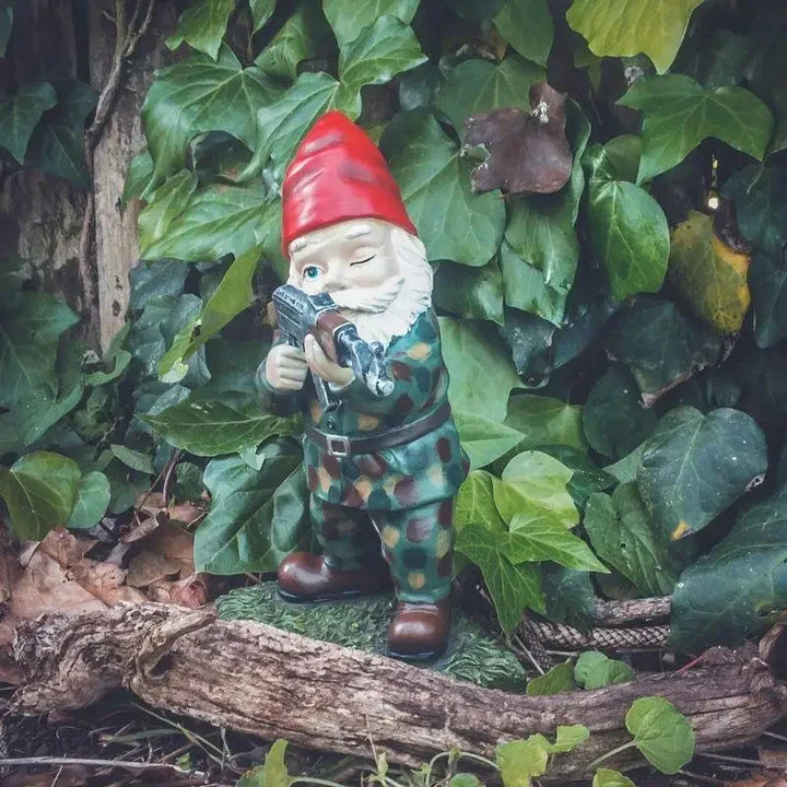 Whimsical garden gnome warrior, a funny yard art ornament adding character to your outdoor space.