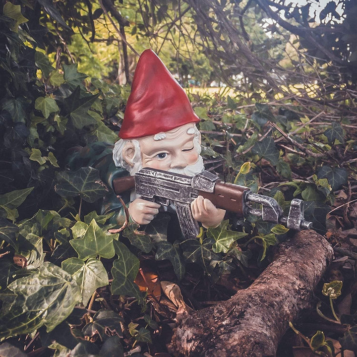 Humorous garden gnome warrior ready for battle, a weatherproof lawn ornament and funny garden statue.