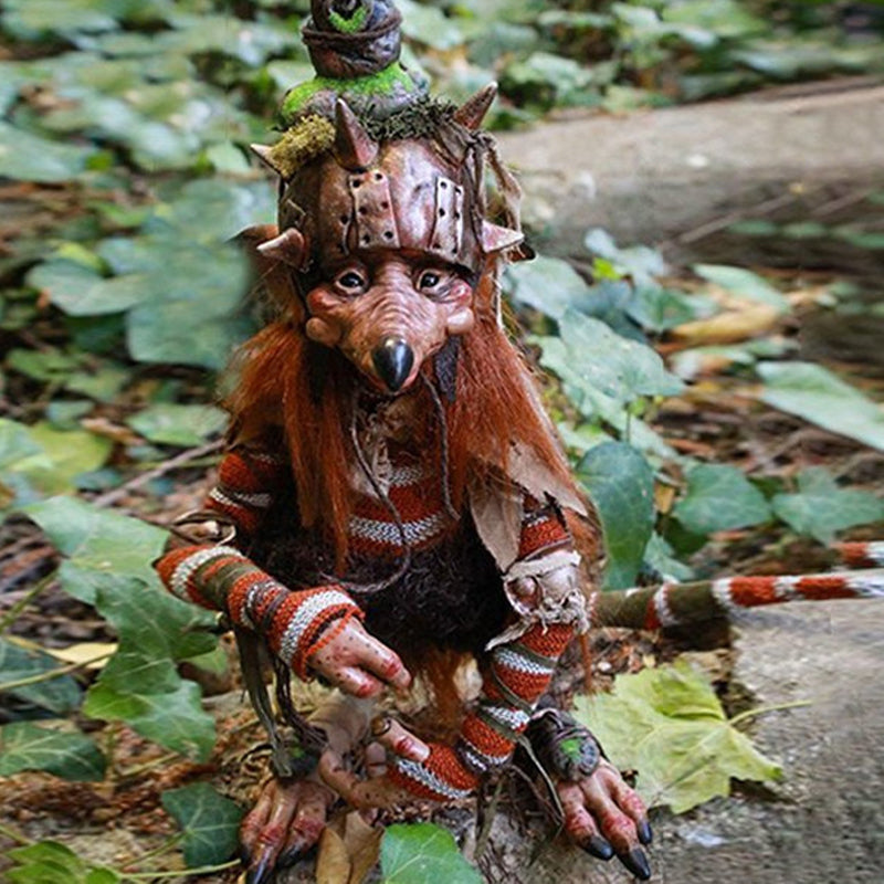 Whimsical garden goblin figurine, perfect outdoor statue & yard art decor for fantasy lovers.