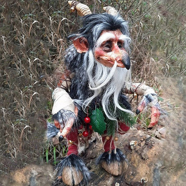 Detailed plastic garden goblin figurine, a whimsical collectible outdoor statue for yard art.