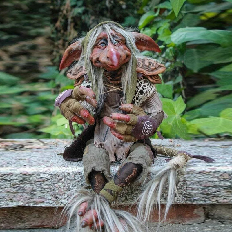 Charming garden goblin figurine, a whimsical fantasy outdoor statue for unique yard decor.