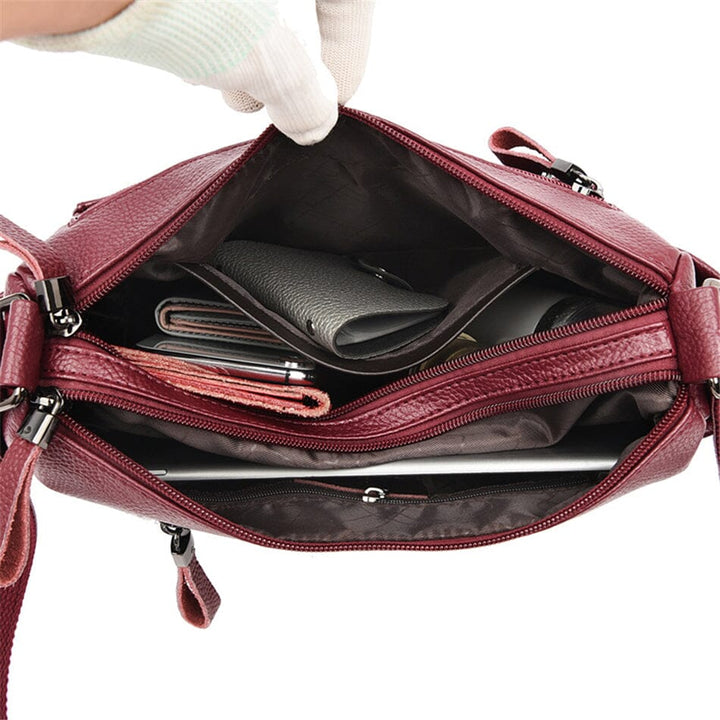 Sleek genuine leather women's handbag. Elegant luxury shoulder bag, a modern fashion accessory.