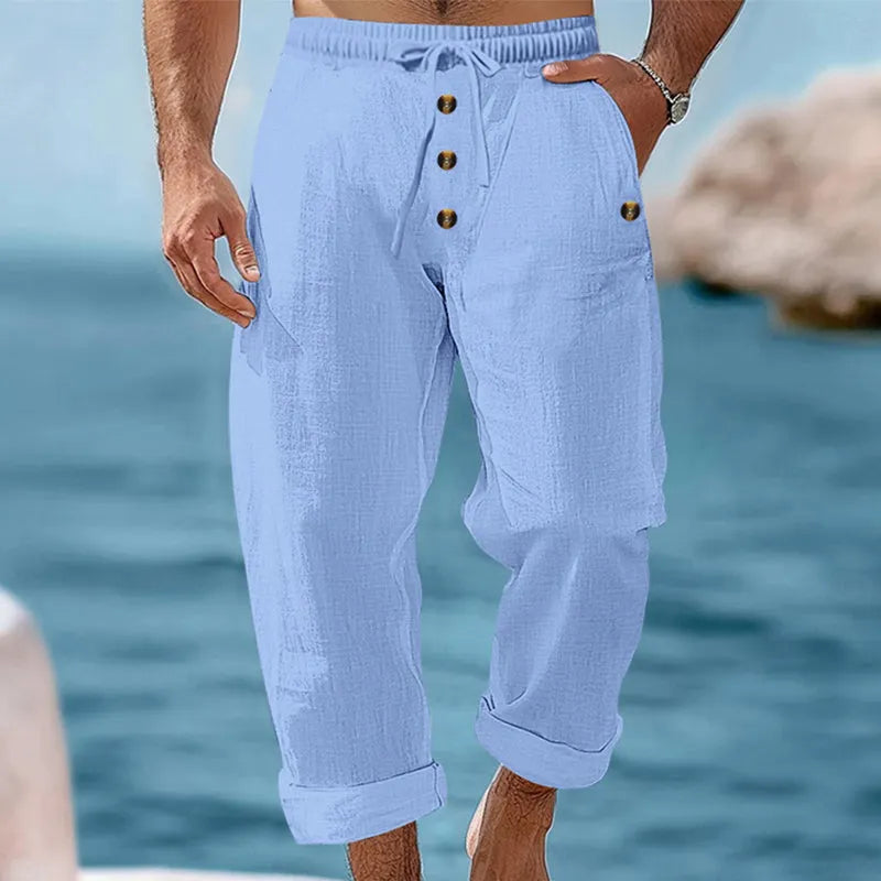 Detail shot of the durable linen fabric and functional cargo pockets on men's summer pants.