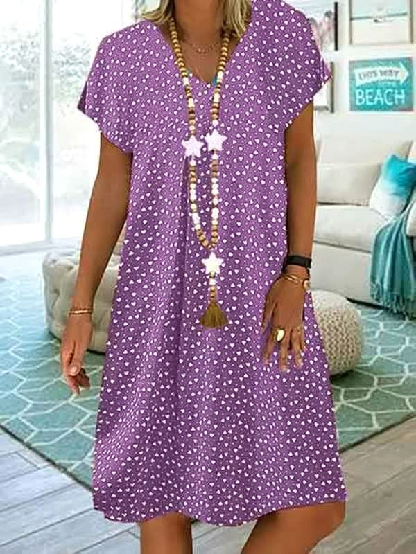 Lightweight women's polka dot midi dress, perfect for warm weather and versatile day-to-night summer wear.