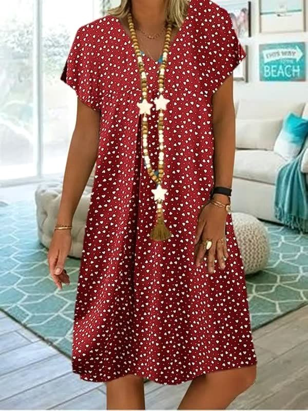 Flowy women's polka dot midi dress, providing an elegant silhouette and effortless style for summer fashion.