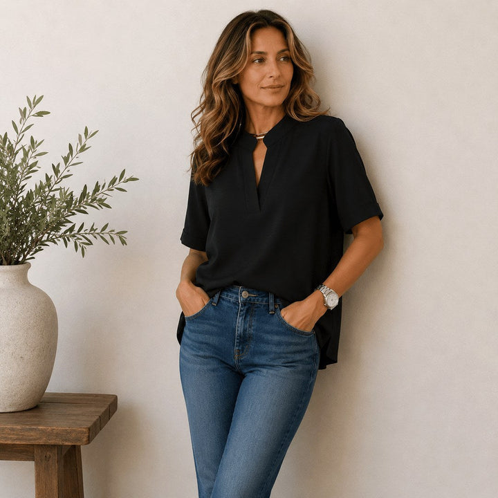 Womens short-sleeve V-neck top, versatile and elegant for casual and everyday wear.