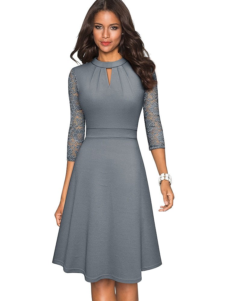 Navy blue A-line party dress with elegant sheer sleeves, ideal for wedding guests or formal wear.