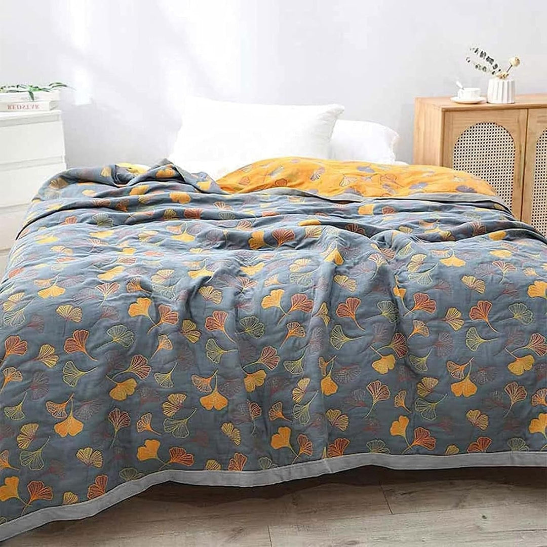 Soft botanical ginkgo leaf throw blanket for cozy comfort, reversible design for stylish home decor.