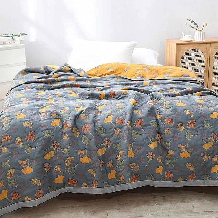 Soft botanical ginkgo leaf throw blanket for cozy comfort, reversible design for stylish home decor.