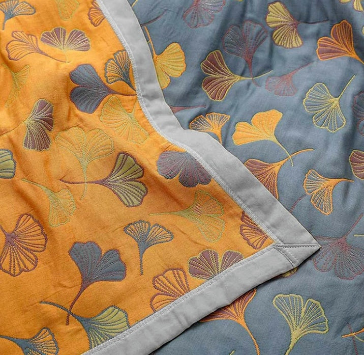 Botanical ginkgo leaf throw blanket, reversible blue & yellow, ultimate cozy comfort home decor item.