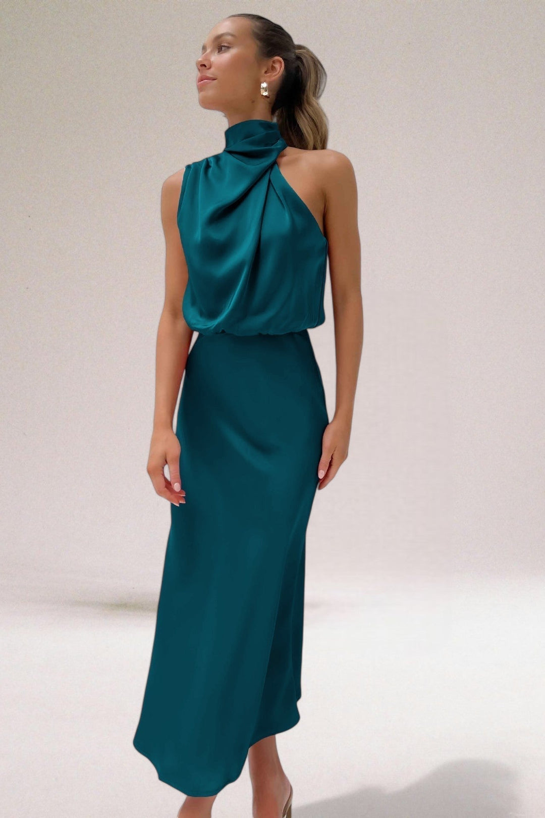 Women's flowy halter neck maxi dress, ideal as an elegant evening gown or formal party dress.