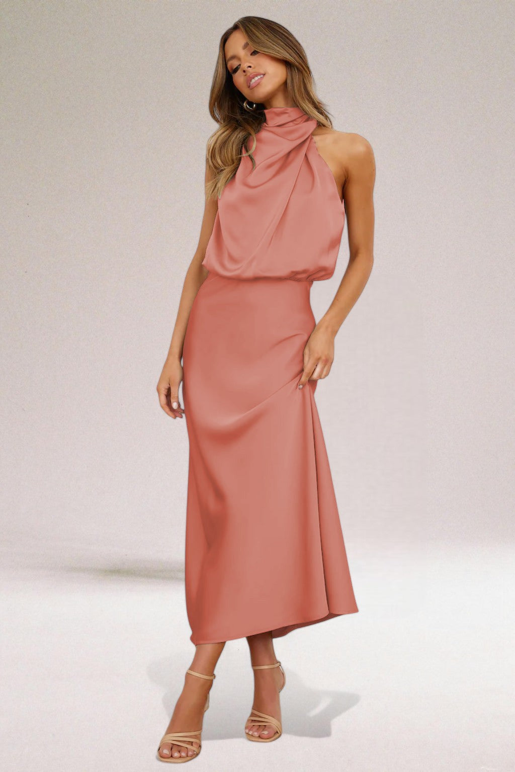 Elegant sleeveless maxi dress for women with a glamorous halter neck, suitable for formal events & parties.