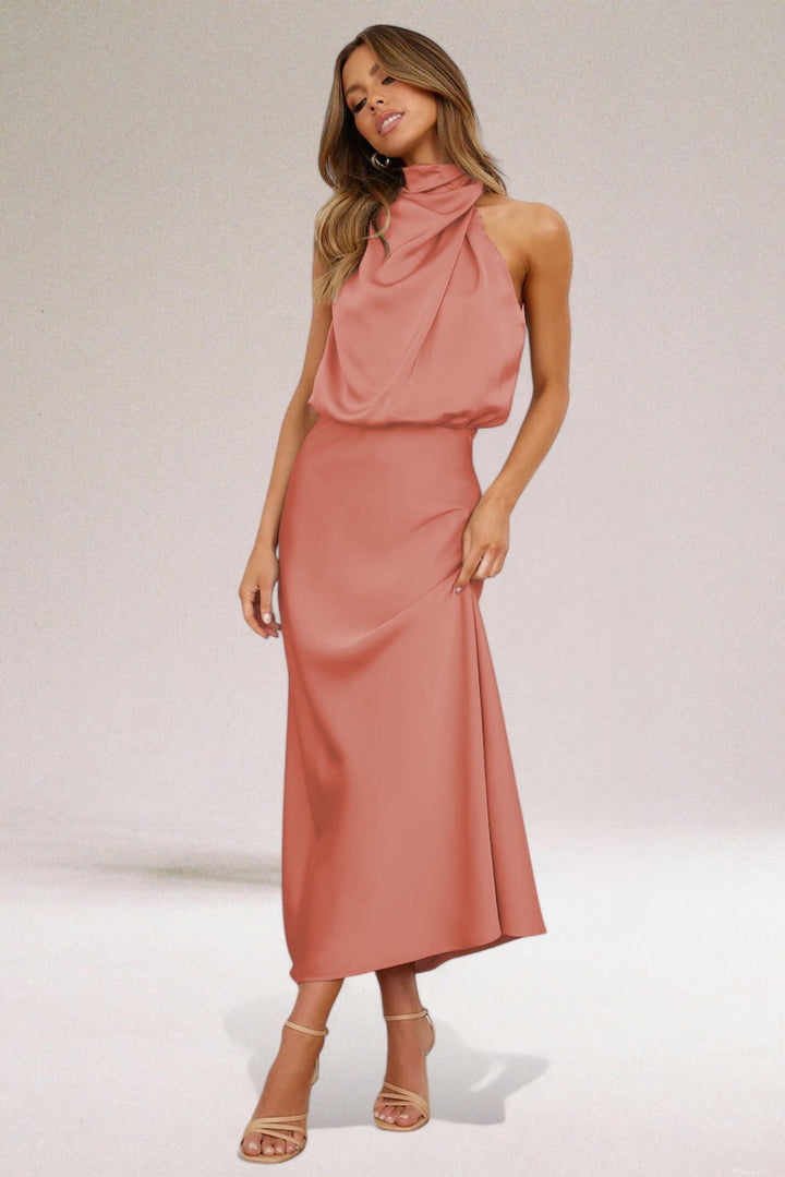 Elegant sleeveless maxi dress for women with a glamorous halter neck, suitable for formal events & parties.