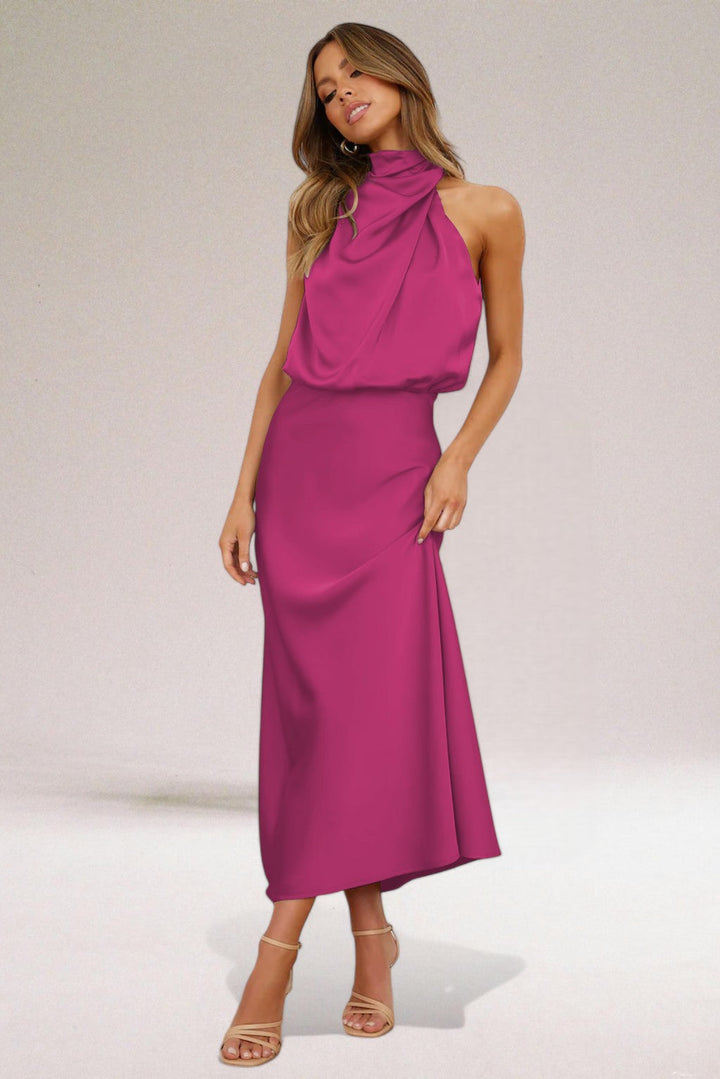 Chic women's halter neck maxi dress, featuring a flowy design for glamorous formal & evening events.